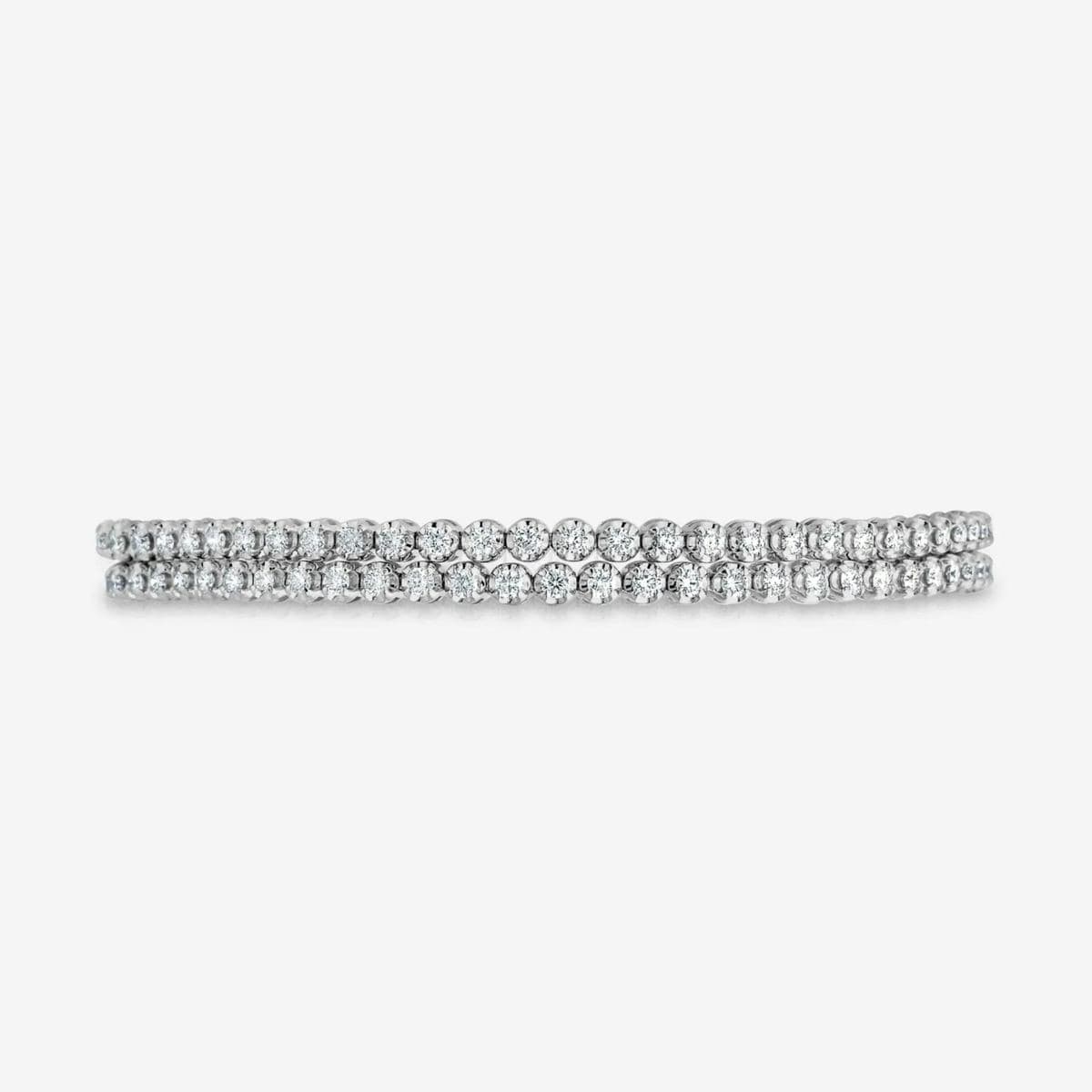 Two white gold rows of prong-set round stones stacked, shown edge-on in a catalog front view