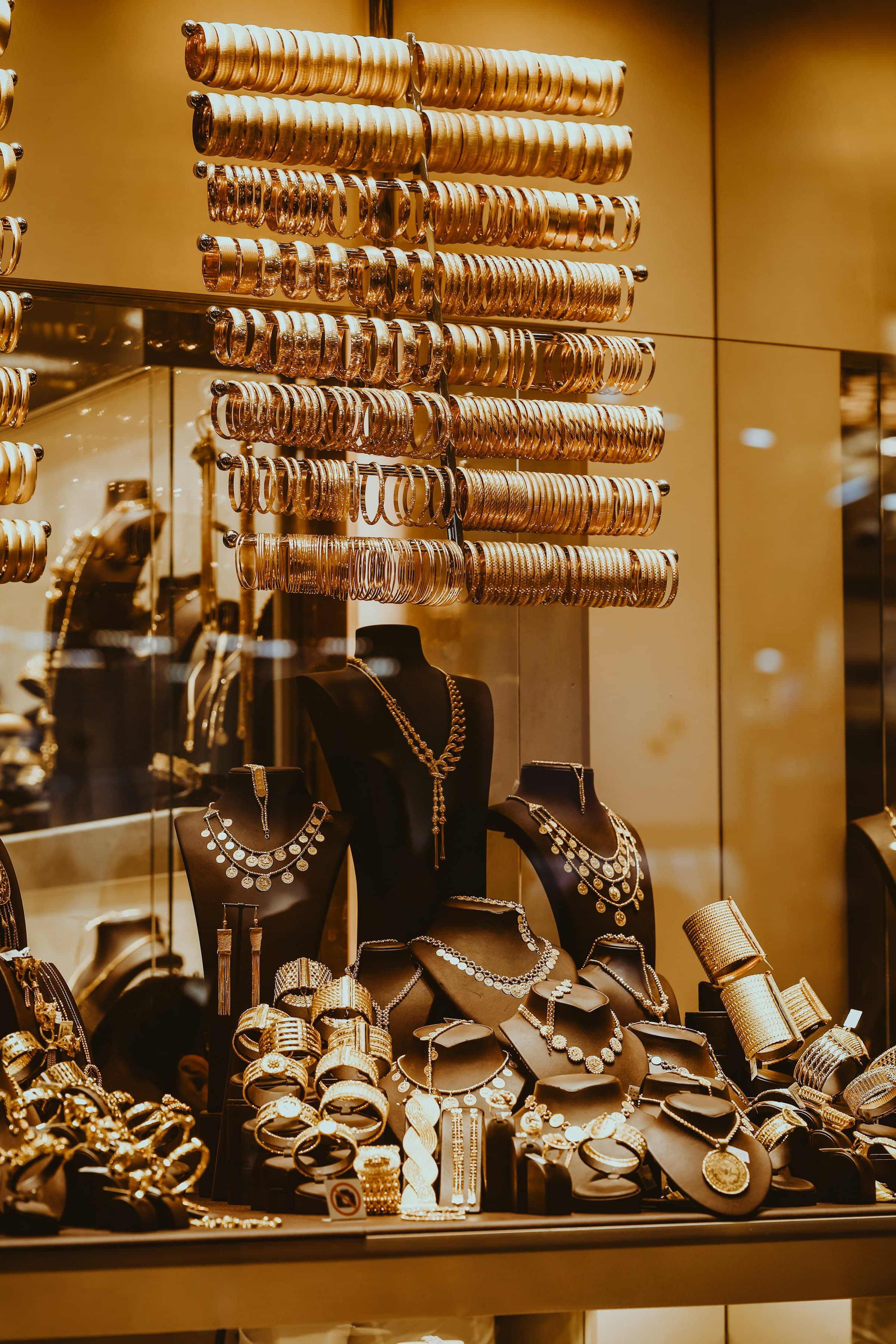 Gold chains hanging in the store's cases